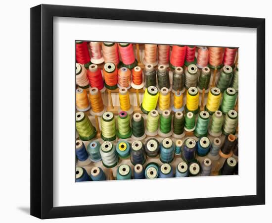 Multi-colored thread in high school sewing class-null-Framed Photographic Print