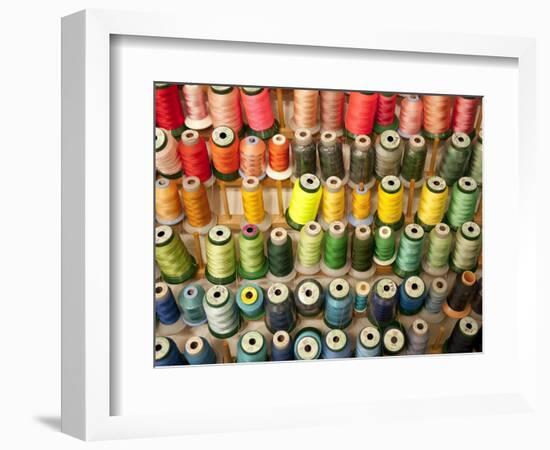 Multi-colored thread in high school sewing class-null-Framed Photographic Print