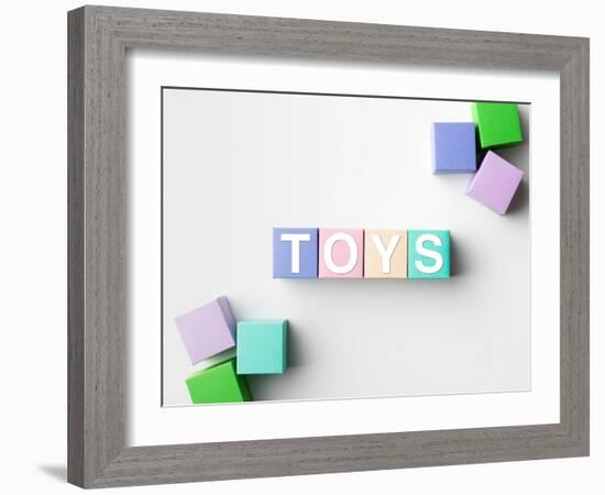 Multicolored Blocks with Toys Word Written on Them, on White. Copy Space Available-Abstract Oil Work-Framed Photographic Print