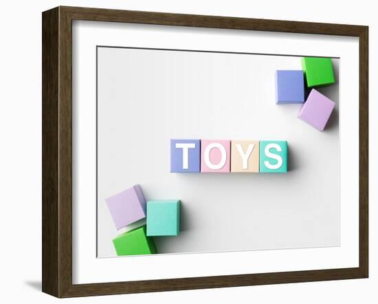 Multicolored Blocks with Toys Word Written on Them, on White. Copy Space Available-Abstract Oil Work-Framed Photographic Print