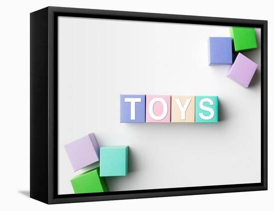 Multicolored Blocks with Toys Word Written on Them, on White. Copy Space Available-Abstract Oil Work-Framed Premier Image Canvas