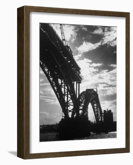 Multiple Arc Bridge under Construction Across the Dnieper River Below the World's Largest Dam-Margaret Bourke-White-Framed Photographic Print