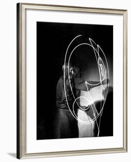 Multiple Exposure of Artist Pablo Picasso Using Flashlight to Make Light Drawing in the Air-Gjon Mili-Framed Premium Photographic Print