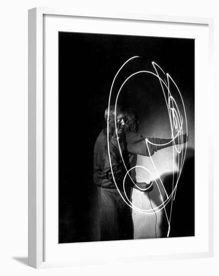 Multiple Exposure of Artist Pablo Picasso Using Flashlight to Make Light Drawing in the Air-Gjon Mili-Framed Premium Photographic Print