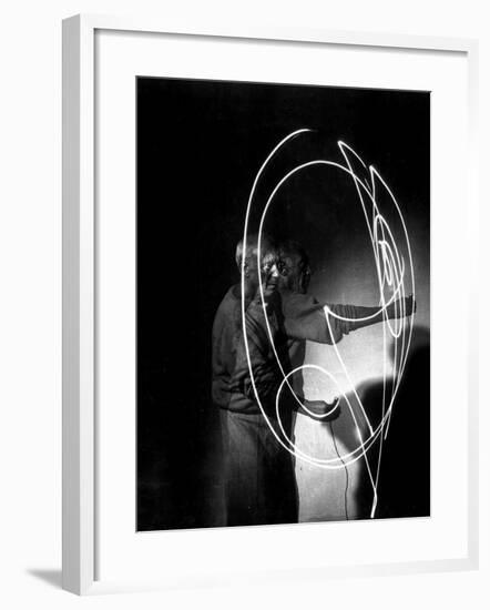 Multiple Exposure of Artist Pablo Picasso Using Flashlight to Make Light Drawing in the Air-Gjon Mili-Framed Premium Photographic Print