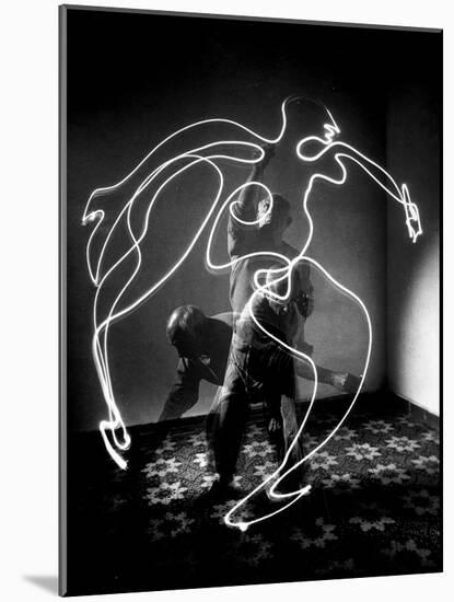 Multiple Exposure of Artist Pablo Picasso Using Flashlight to Make Light Drawing of a Figure-Gjon Mili-Mounted Photographic Print