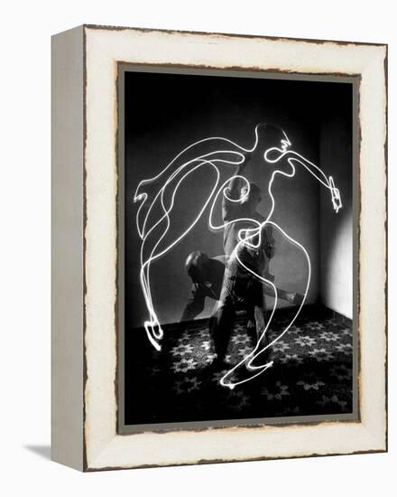 Multiple Exposure of Artist Pablo Picasso Using Flashlight to Make Light Drawing of a Figure-Gjon Mili-Framed Premier Image Canvas