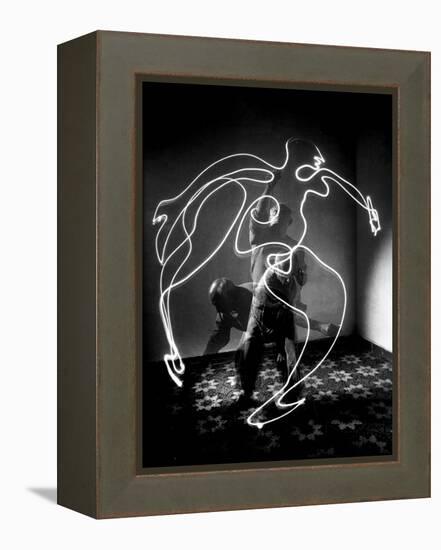 Multiple Exposure of Artist Pablo Picasso Using Flashlight to Make Light Drawing of a Figure-Gjon Mili-Framed Premier Image Canvas