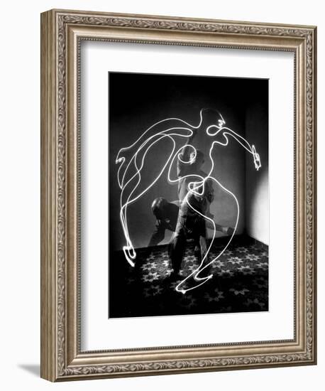 Multiple Exposure of Artist Pablo Picasso Using Flashlight to Make Light Drawing of a Figure-Gjon Mili-Framed Photographic Print