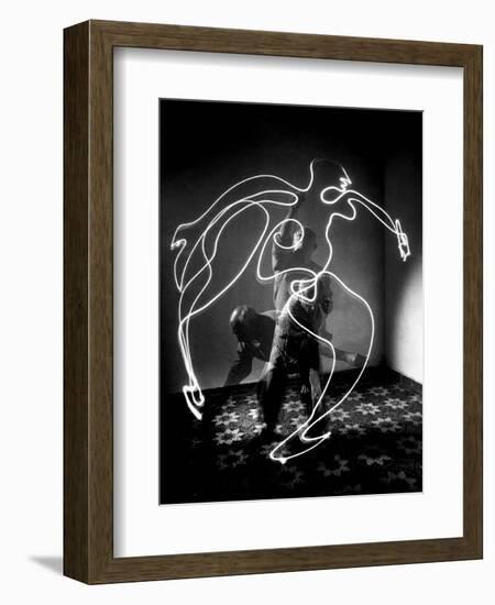 Multiple Exposure of Artist Pablo Picasso Using Flashlight to Make Light Drawing of a Figure-Gjon Mili-Framed Photographic Print