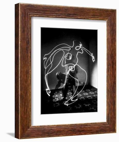 Multiple Exposure of Artist Pablo Picasso Using Flashlight to Make Light Drawing of a Figure-Gjon Mili-Framed Photographic Print