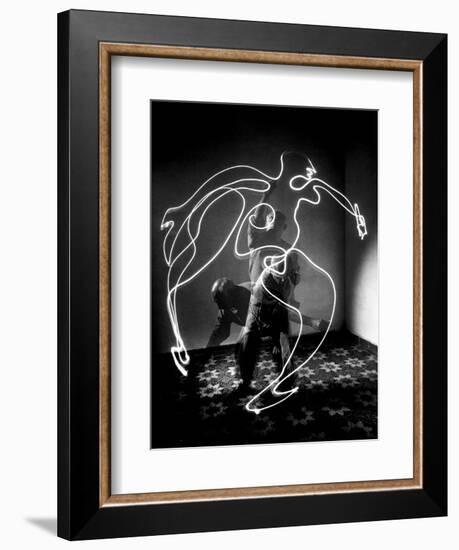 Multiple Exposure of Artist Pablo Picasso Using Flashlight to Make Light Drawing of a Figure-Gjon Mili-Framed Photographic Print