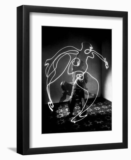 Multiple Exposure of Artist Pablo Picasso Using Flashlight to Make Light Drawing of a Figure-Gjon Mili-Framed Photographic Print