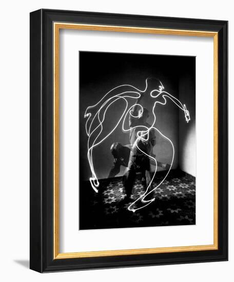 Multiple Exposure of Artist Pablo Picasso Using Flashlight to Make Light Drawing of a Figure-Gjon Mili-Framed Photographic Print