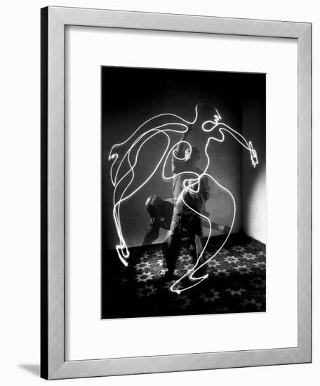 Multiple Exposure of Artist Pablo Picasso Using Flashlight to Make Light Drawing of a Figure-Gjon Mili-Framed Premium Photographic Print