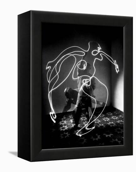 Multiple Exposure of Artist Pablo Picasso Using Flashlight to Make Light Drawing of a Figure-Gjon Mili-Framed Premier Image Canvas
