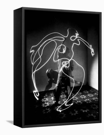 Multiple Exposure of Artist Pablo Picasso Using Flashlight to Make Light Drawing of a Figure-Gjon Mili-Framed Premier Image Canvas