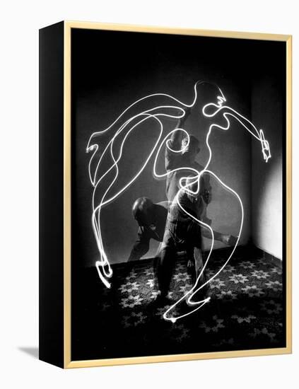 Multiple Exposure of Artist Pablo Picasso Using Flashlight to Make Light Drawing of a Figure-Gjon Mili-Framed Premier Image Canvas