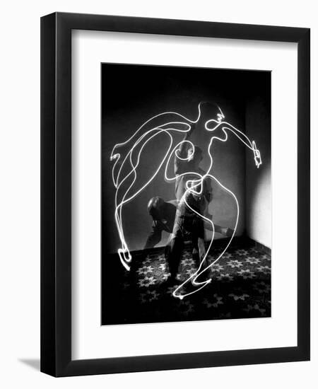 Multiple Exposure of Artist Pablo Picasso Using Flashlight to Make Light Drawing of a Figure-Gjon Mili-Framed Giclee Print