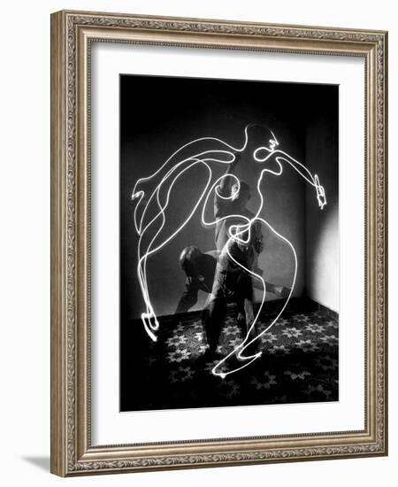 Multiple Exposure of Artist Pablo Picasso Using Flashlight to Make Light Drawing of a Figure-Gjon Mili-Framed Giclee Print