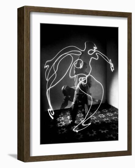 Multiple Exposure of Artist Pablo Picasso Using Flashlight to Make Light Drawing of a Figure-Gjon Mili-Framed Giclee Print