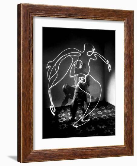 Multiple Exposure of Artist Pablo Picasso Using Flashlight to Make Light Drawing of a Figure-Gjon Mili-Framed Giclee Print