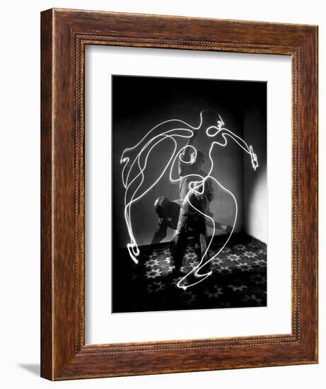 Multiple Exposure of Artist Pablo Picasso Using Flashlight to Make Light Drawing of a Figure-Gjon Mili-Framed Premium Giclee Print