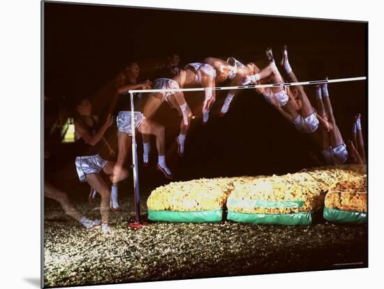 Multiple Exposure of Dick Fosbury in Action During High Jump at Summer Olympics-Michael Rougier-Mounted Premium Photographic Print