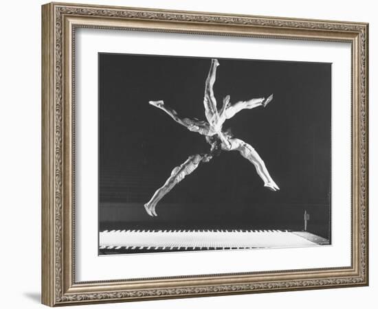 Multiple Exposure Shot of a Gymnast Jumping on a Trampoline-J^ R^ Eyerman-Framed Photographic Print