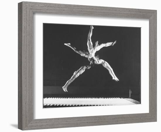 Multiple Exposure Shot of a Gymnast Jumping on a Trampoline-J^ R^ Eyerman-Framed Photographic Print