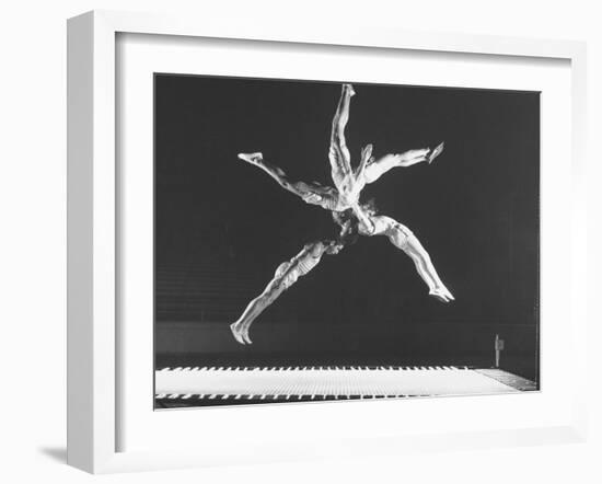 Multiple Exposure Shot of a Gymnast Jumping on a Trampoline-J^ R^ Eyerman-Framed Photographic Print