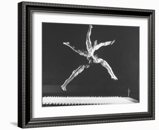 Multiple Exposure Shot of a Gymnast Jumping on a Trampoline-J^ R^ Eyerman-Framed Photographic Print