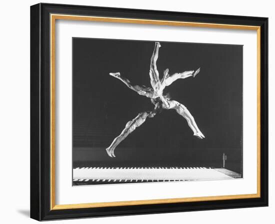 Multiple Exposure Shot of a Gymnast Jumping on a Trampoline-J^ R^ Eyerman-Framed Photographic Print