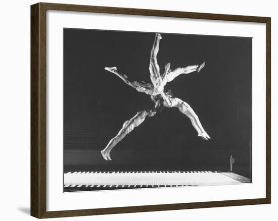 Multiple Exposure Shot of a Gymnast Jumping on a Trampoline-J^ R^ Eyerman-Framed Photographic Print