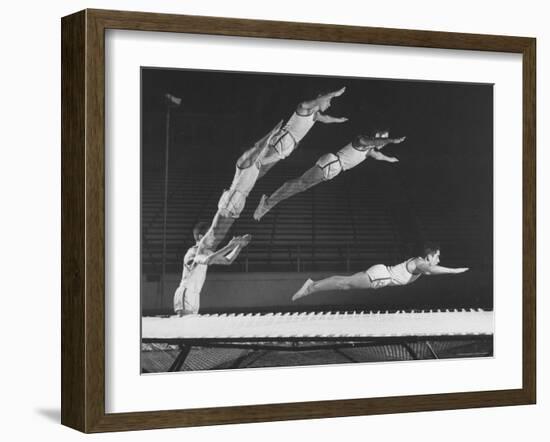 Multiple Exposure Shot of a Gymnast Jumping on a Trampoline-J^ R^ Eyerman-Framed Photographic Print