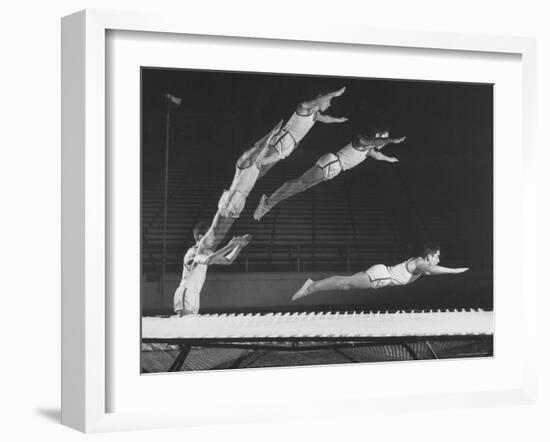 Multiple Exposure Shot of a Gymnast Jumping on a Trampoline-J^ R^ Eyerman-Framed Photographic Print