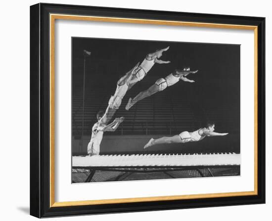 Multiple Exposure Shot of a Gymnast Jumping on a Trampoline-J^ R^ Eyerman-Framed Photographic Print