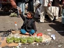 Afghan Child 5, Receives a Bottle of Water-Musadeq Sadeq-Framed Premier Image Canvas