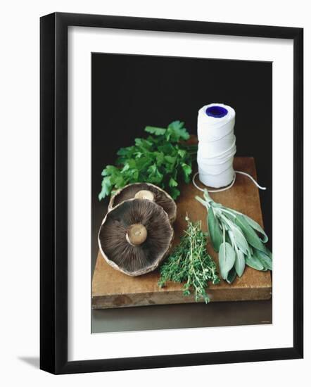 Mushrooms, Fresh Herbs & Kitchen String on Chopping Board-Michael Paul-Framed Photographic Print