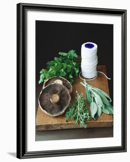 Mushrooms, Fresh Herbs & Kitchen String on Chopping Board-Michael Paul-Framed Photographic Print