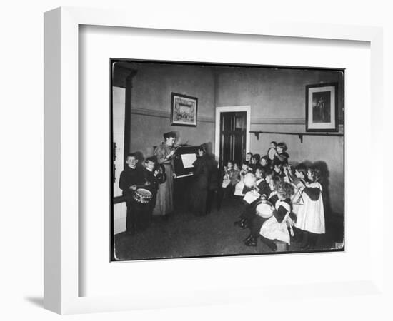 Music Lesson at a German School. One Teacher Plays the Piano-null-Framed Art Print