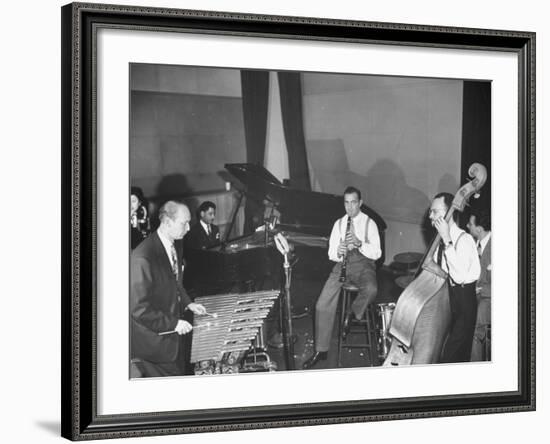 Musician Benny Goodman Playing the Clarinet While Making a Record-null-Framed Photographic Print