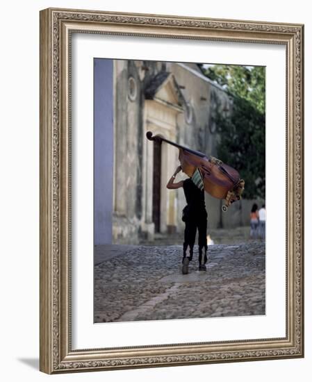 Musician Carrying Double Bass Along Cobbled Street to Plaza Mayor, Trinidad, Cuba-Lee Frost-Framed Photographic Print