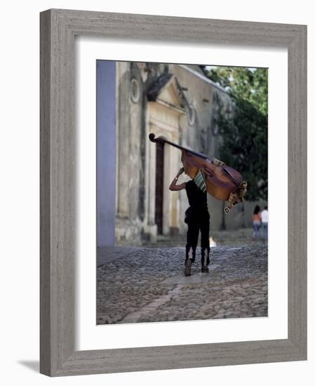 Musician Carrying Double Bass Along Cobbled Street to Plaza Mayor, Trinidad, Cuba-Lee Frost-Framed Photographic Print