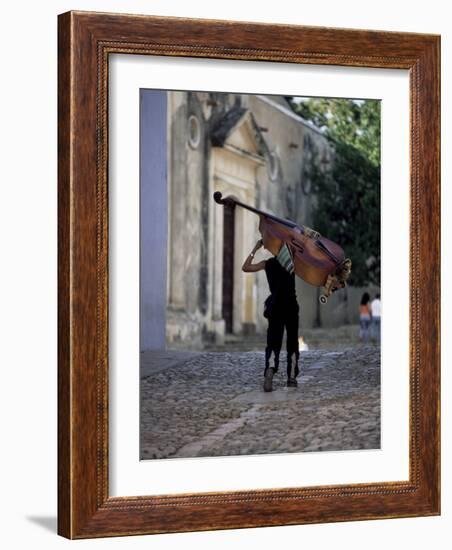 Musician Carrying Double Bass Along Cobbled Street to Plaza Mayor, Trinidad, Cuba-Lee Frost-Framed Photographic Print