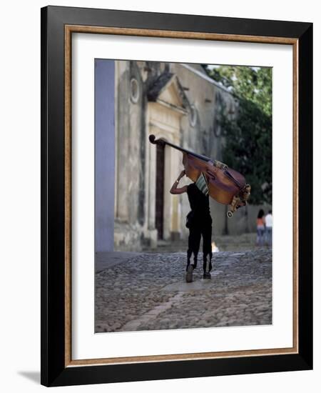 Musician Carrying Double Bass Along Cobbled Street to Plaza Mayor, Trinidad, Cuba-Lee Frost-Framed Photographic Print