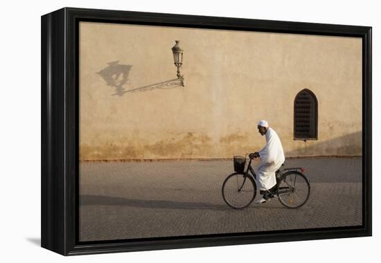 Muslim Man Dressed in White on Bicycle in Old Quarter, Medina, Marrakech, Morocco-Stephen Studd-Framed Premier Image Canvas