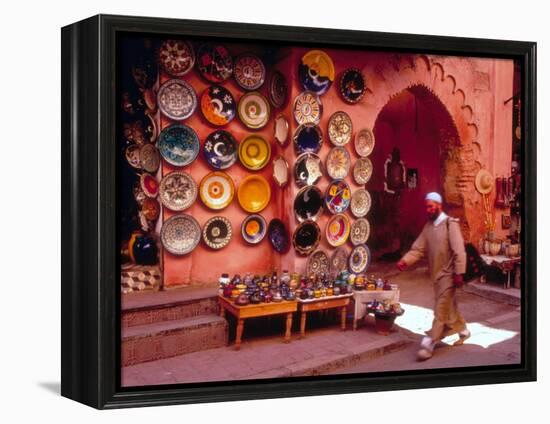Muslim Man Walks by Wall of Moroccan Pottery, Marrakech, Morocco-John & Lisa Merrill-Framed Premier Image Canvas