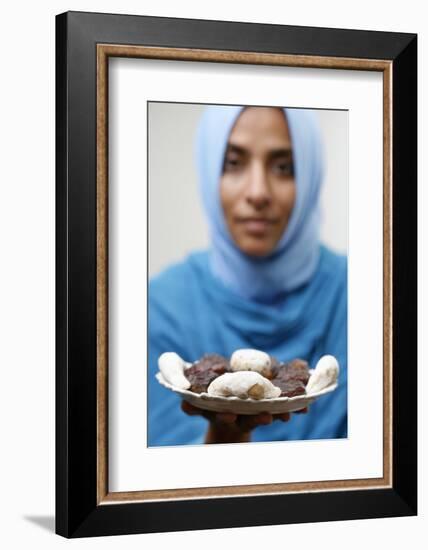 Muslim woman offering Ramadan pastries-Godong-Framed Photographic Print