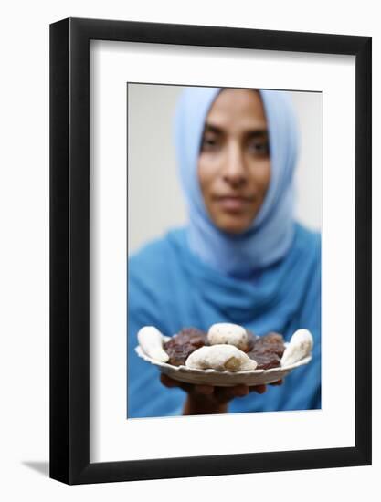 Muslim woman offering Ramadan pastries-Godong-Framed Photographic Print